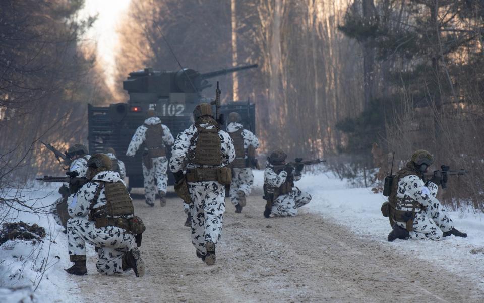 Ukraine forces train in the town of Pripyat, as Russia has massed 100,000 troops on the border - JULIAN SIMMONDS 