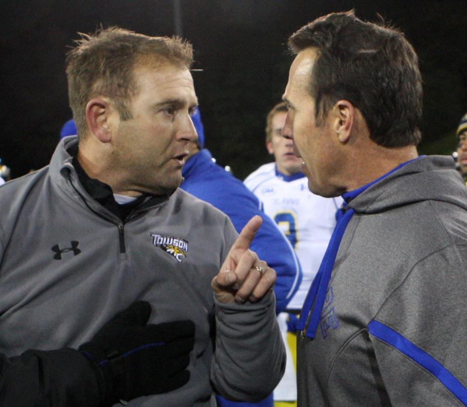 Towson coach Rob Ambrose (left) and former Delaware coach K.C. Keeler have a spat after the Blue Hens' 35-30 win at Towson in 2011.