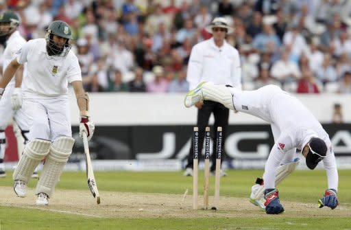Hashim Amla of South Africa (left) is run out by England's wicketkeeper Matt Prior during the second international Test cricket match between England and South Africa at Headingley Carnegie in Leeds. England claimed three wickets on the first afternoon of the second Test against South Africa at Headingley, fighting back after a wicketless morning and a heavy defeat in the series opener