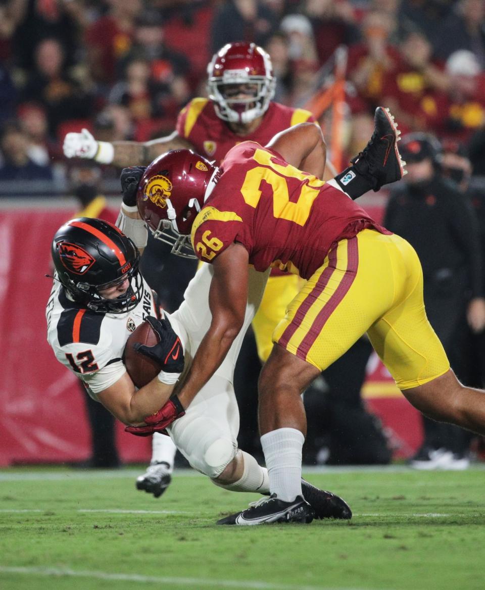 USC linebacker Kana'i Mauga hits Oregon State quarterback Jack Colletto during the first half.