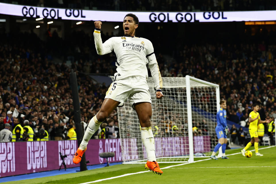 Real Madrid's Jude Bellingham celebrates after scoring the opening goal during the Spanish La Liga soccer match between Real Madrid and Villarreal at the Santiago Bernebeu stadium in Madrid, Spain, Sunday, Dec. 17, 2023. (AP Photo/Pablo Garcia)