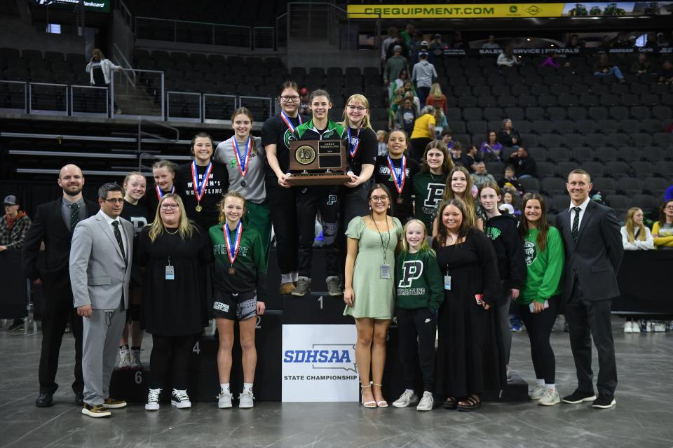 The Pierre girl's wrestling pose for their state championship win on Saturday, Feb. 24, 2024 at the Denny Sanford Premier Center in Sioux Falls.