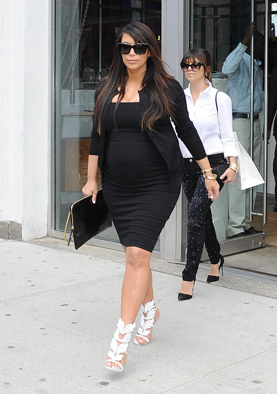 NEW YORK, NY - APRIL 22:  Kim Kardashian and Kourtney Kardashian as seen on April 22, 2013 in New York City.  (Photo by NCP/Star Max/FilmMagic)