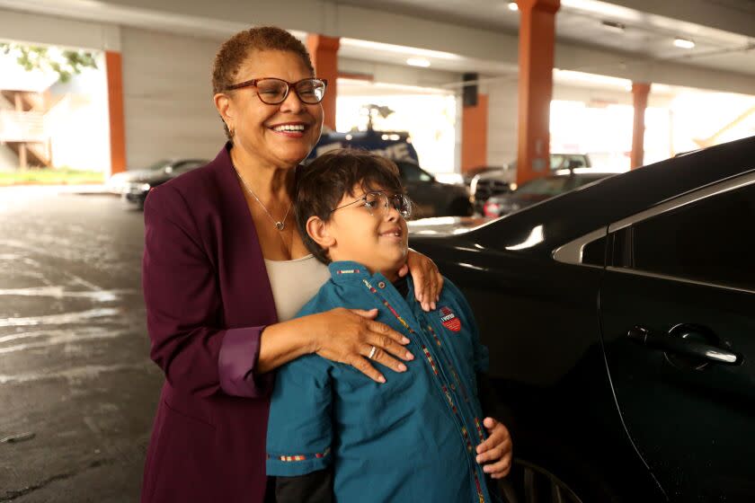 LOS ANGELES, CA - NOVEMBER 8, 2022 - - Los Angeles mayoral candidate Rep. Karen Bass, hugs her grandson Henry, 8, after voting at the Baldwin Hills Crenshaw Center in Los Angeles on November 8, 2022. (Genaro Molina / Los Angeles Times)