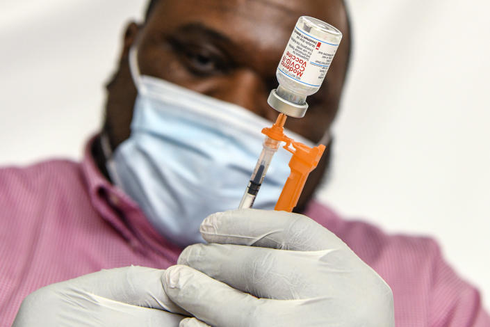 A pharmacist prepares doses of the Moderna COVID-19 vaccine in Hagerstown, Md., Feb.  22, 2022. (Kenny Holston/The New York Times)