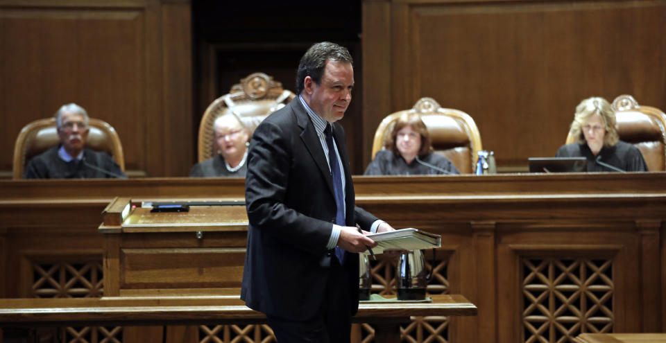 Paul J. Lawrence, attorney for the Legislature, returns to his seat after addressing justices during a hearing before the Washington Supreme Court Tuesday, June 11, 2019, in Olympia, Wash. The court heard oral arguments in the case that will determine whether state lawmakers are subject to the same disclosure rules that apply to other elected officials under the voter-approved Public Records Act. The hearing before the high court was an appeal of a case that was sparked by a September 2017 lawsuit filed by a media coalition, led by The Associated Press. (AP Photo/Elaine Thompson)