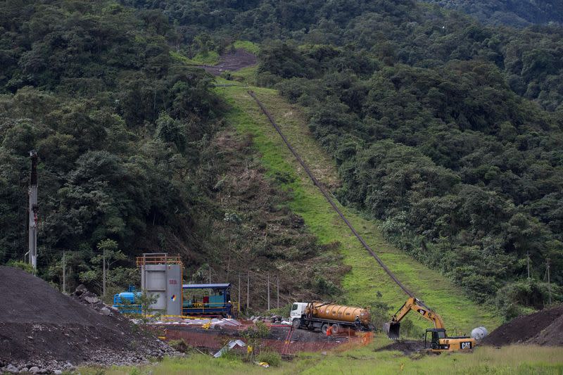 An excavator is parked near a damaged section of oil pipeline about 25 km from the city of Tena in the Amazon