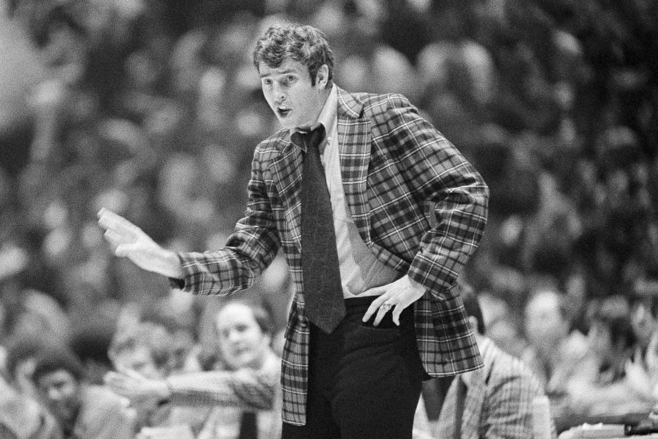 FILE - Indiana University basketball coach Bobby Knight signals his team to "freeze" the ball during the last minutes of play against UCLA in an NCAA college basketball semifinal game in Philadelphia, March 27, 1976. Bob Knight won three national championships at Indiana, but his first was perfect. (AP Photo/File)