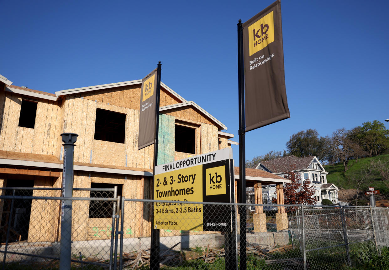 NOVATO, CALIFORNIA - JANUARY 12: Signs are posted in front of homes under construction at a KB Home housing development on January 12, 2022 in Novato, California. Homebuilder KB Home will report fourth quarter earnings today after the closing bell. (Photo by Justin Sullivan/Getty Images)