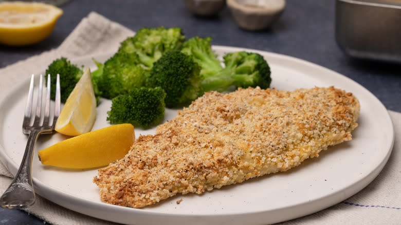 baked almond-crusted tilapia on plate