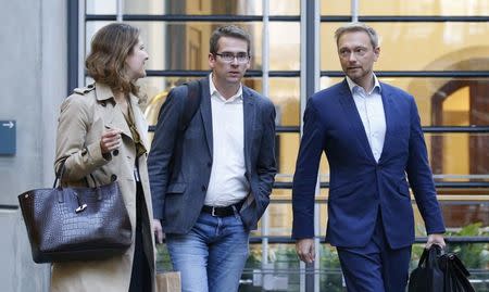 Leader of the Free Democratic Party (FDP) Christian Lindner leaves the venue after the second day of the exploratory talks with CDU/CSU about forming a new coalition government in Berlin, Germany, October 19, 2017. REUTERS/Axel Schmidt