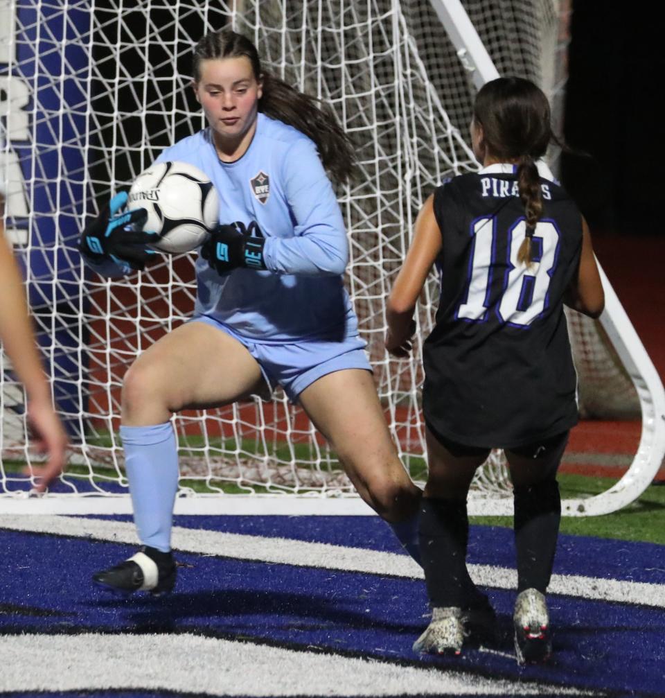 Rye goalie Tessa Labowitz grabs the ball away from Pearl River's Mya Chesman during their game at Pearl River Oct. 16, 2023. Rye won 1-0.