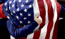 <p>A fan wearing the American flag cheers during the Men’s Curling Semi-Final match between United States and Canada at the PyeongChang 2018 Winter Olympics in South Korea, Feb. 22, 2018. United States won.<br>(AP Photo/Aaron Favila) </p>