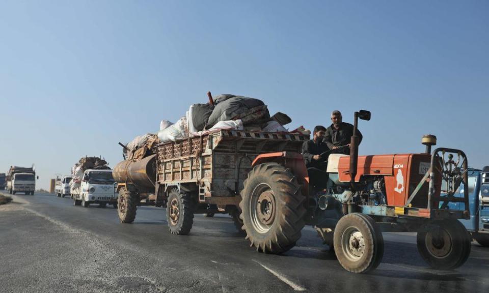Civilians flee a conflict zone in Syria’s rebel-held region of Idlib.