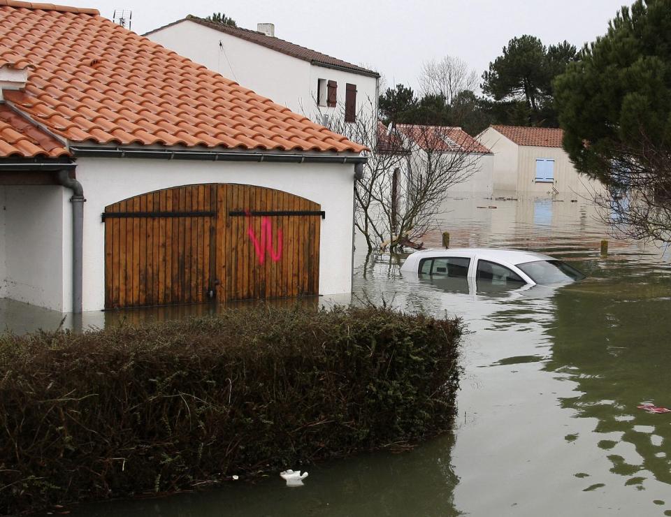 Flooded streets of La Faute sur Mer, on the Atlantic coast, south western France are seen after a storm, Monday, March 1, 2010. _AP_David Vincent