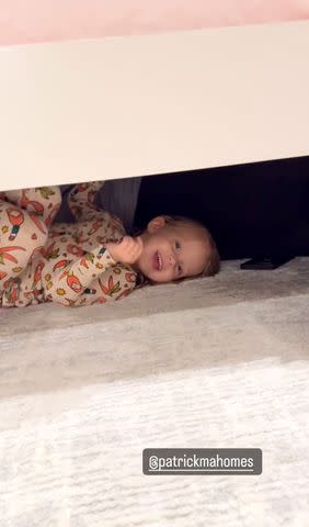 <p>Brittany Mahomes/Instagram</p> Sterling Skye laughing under the bed