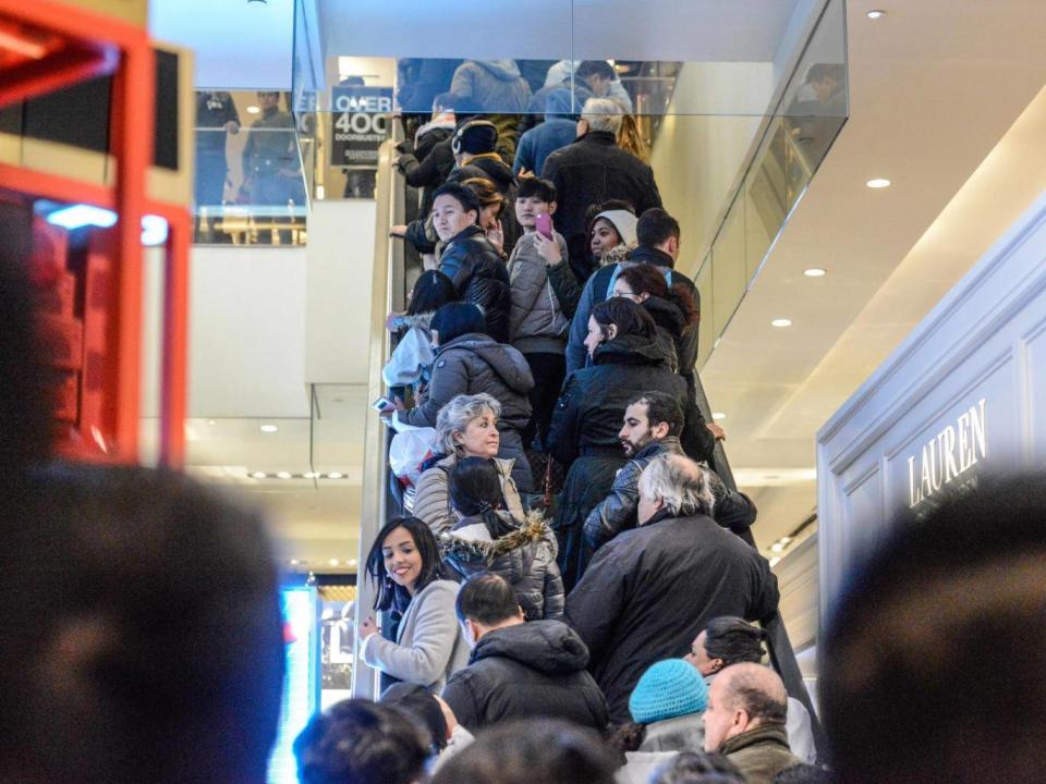 People shop at Macy's department store on Thanksgiving Day (Getty)