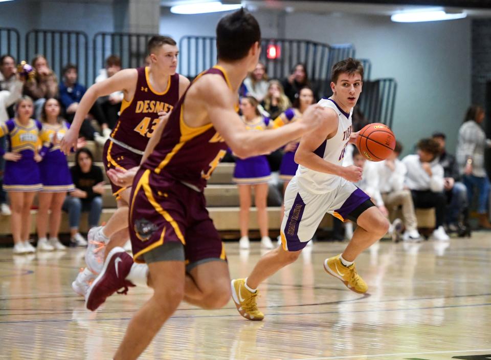 White River's Joe Sayler drives down the court, accompanied by De Smet on defense, on Saturday, January 22, 2022, in the Hanson Classic at the Corn Palace in Mitchell.