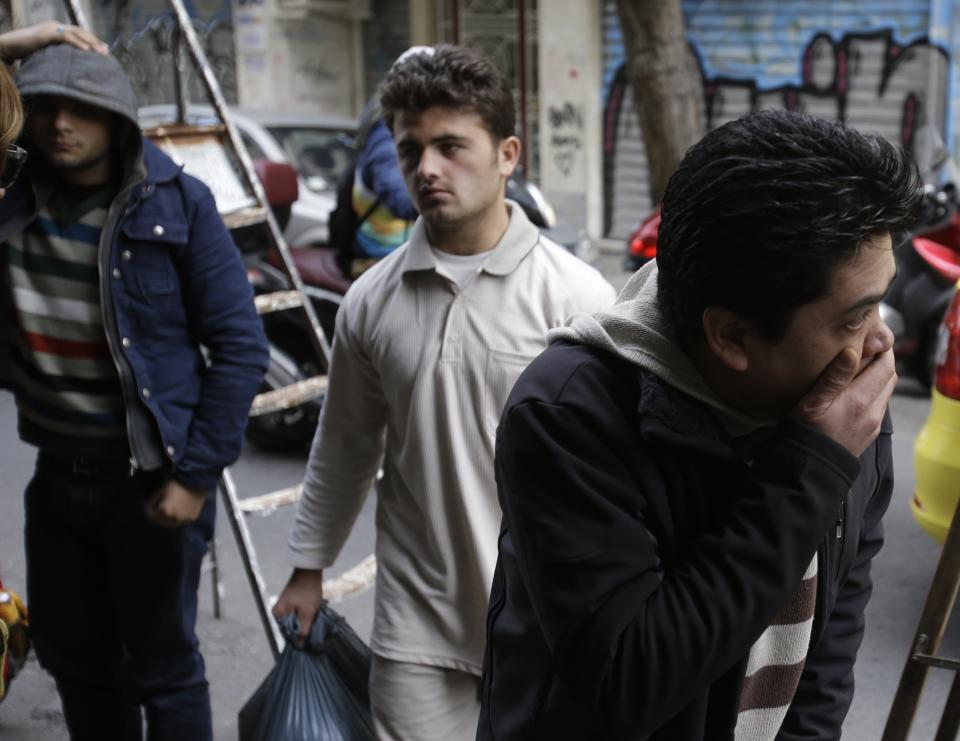 Immigrants who survived from a deadly boat accident arrives at the Greek Council of Refugees in Athens on Thursday, Jan. 23, 2014. A top European human rights official criticized Greece on Wednesday following a deadly boat accident involving immigrants in the east Aegean Sea, some of whom claimed that the Greek coast guard was turning them away. Ten people are still missing after a fishing boat crammed with immigrants capsized in the dark Monday near the tiny Greek island of Farmakonisi while being towed by a coast guard vessel. The bodies of a woman and an 11-year-old boy were found by Turkish authorities. (AP Photo/Thanassis Stavrakis)