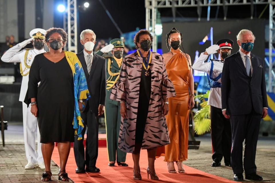 The prime minister of Barbados, Mia Mottley, cricket legend Sir Garfield Sobers, the president of Barbados, Dame Sandra Mason, Rihanna, and Prince Charles attend the presidential inauguration ceremony at Heroes Square on 30 November in Bridgetown (Getty)