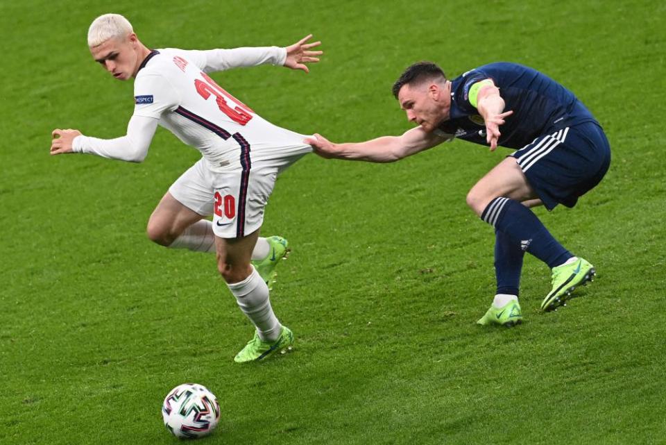 Phil Foden (left) in action for England against Scotland at Euro 2020.