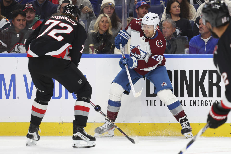 Colorado Avalanche left wing Miles Wood (28) is pressured by Buffalo Sabres right wing Tage Thompson (72) during the first period of an NHL hockey game Sunday, Oct. 29, 2023, in Buffalo, N.Y. (AP Photo/Jeffrey T. Barnes)