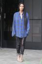 <p>In a blue and grey oversized plaid flannel, lace-up leather pants by Unravel, and snakeskin Gianvito Rossi heeled sandals while out in LA.</p>