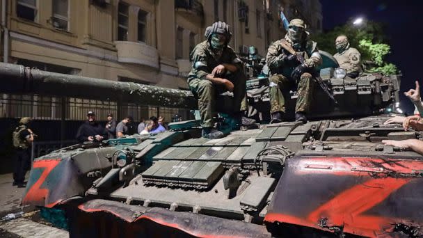 PHOTO: Members of the Wagner Group military company sit atop of a tank on a street in Rostov-on-Don, Russia, June 24, 2023, prior to leaving an area at the headquarters of the Southern Military District. (AP)