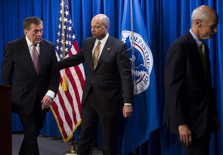 Secretary of Homeland Security Jeh Johnson and former Homeland Security secretaries Tom Ridge (L) and Michael Chertoff (R) leave after speaking about the possible shutdown of the department at a press conference in Washington, DC, February 25, 2015