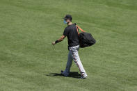 San Francisco Giants' Buster Posey carries his bag during a baseball practice in San Francisco, Sunday, July 5, 2020. (AP Photo/Jeff Chiu)
