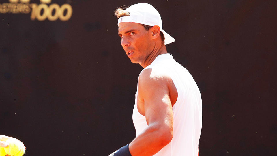 Rafa Nadal (pictured) concentrating during tennis practice.
