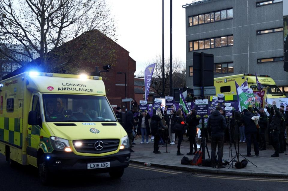 An ambulance on emergency call drives past ambulance workers' strike (file photo) (REUTERS)