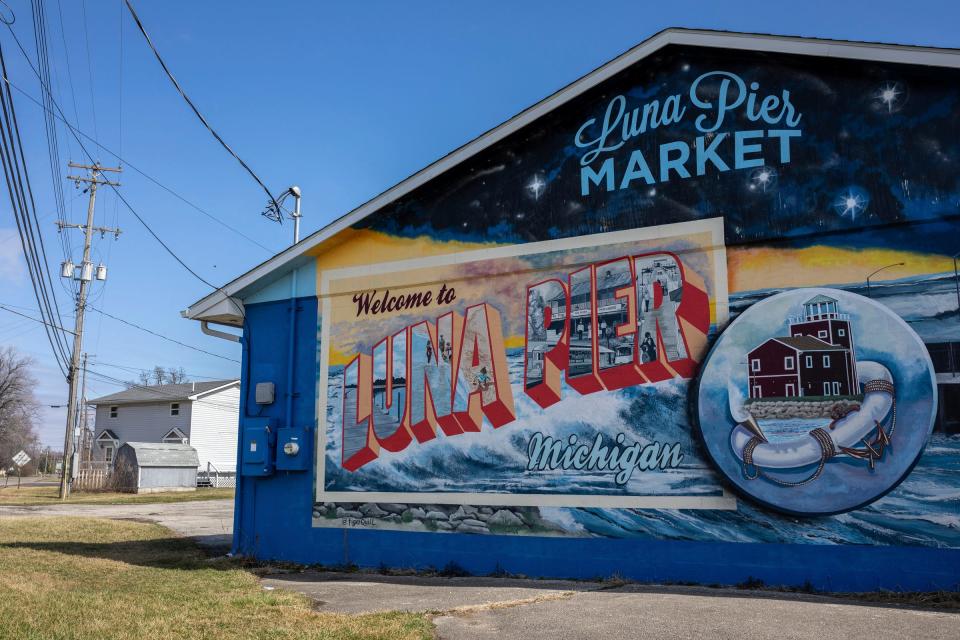 A welcome to Luna Pier mural is painted on the wall of the Luna Pier market on Thursday, March 7, 2024.