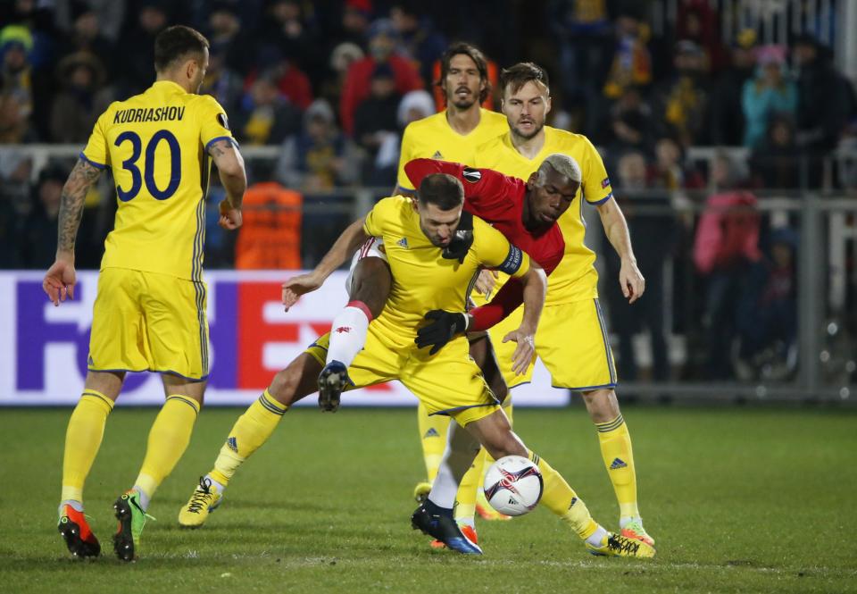 <p>Manchester United’s Paul Pogba, right, and Rostov’s Christian Noboa fight for the ball </p>