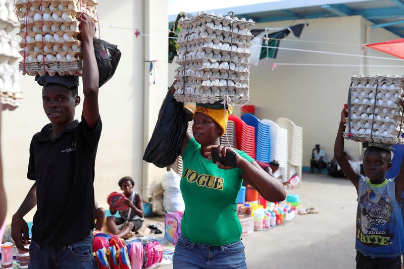 FILE PHOTO: Haitians cross the border to sell eggs in the main binational market for the Dominican Republic and Haiti in Dajabon