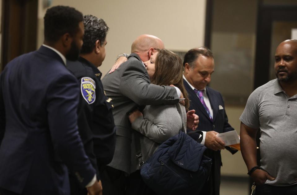 Rochester Police Chief David Smith hugs Lynn Mazurkiewicz in the hallway before the start of the trial of Kelvin Vickers Jr. who is accused of fatally shooting her husband, Rochester Police Officer Anthony Mazurkiewicz, and two other men, Richard Collinge and MyJel Rand in a two day span.