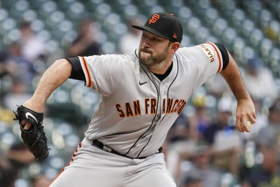 San Francisco Giants starting pitcher Alex Young throws during the first inning of game 2 of a doubleheader baseball game against the Milwaukee Brewers Thursday, Sept. 8, 2022, in Milwaukee. (AP Photo/Morry Gash)