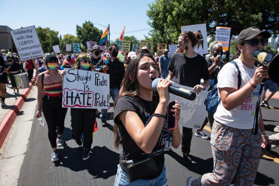 Nancy R. from the Answer Coalition calls out during an impromptu march through Modesto streets after police dispersed the protesters gathered at Planned Parenthood office on McHenry Ave in Modesto, Calif., on Saturday, August 27, 2022. The protest began as a rally to oppose the scheduled Straight Pride event.