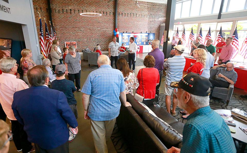GDE owner Scott Donley answers a question posed by Mayor Matt Miller at an open house celebrating the Ashland County Republican Party's move to a new site downtown.