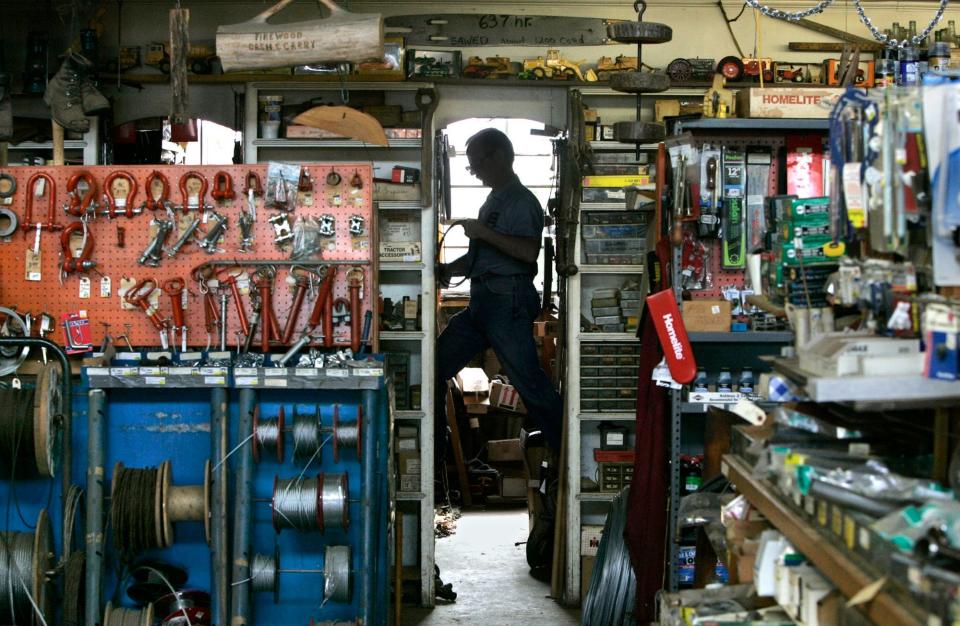 Tom Gamauf checks inventory in 2006 at the family business, Gamauf Hardware, in Copley.