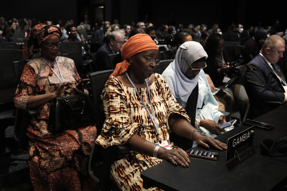 Attendees listen to a review of the state of discussions at the COP27 U.N. Climate Summit, Friday, Nov. 18, 2022, in Sharm el-Sheikh, Egypt. (AP Photo/Nariman El-Mofty)