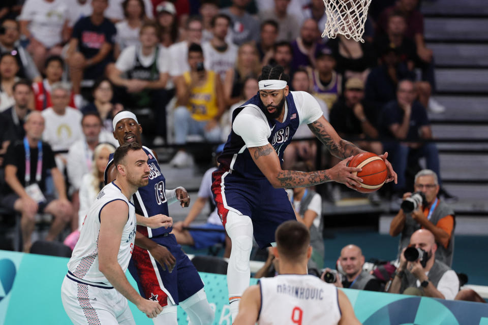 USA's Anthony Davis goes for a rebound in the men's preliminary round group C basketball match between Serbia and USA during the Paris 2024 Olympic Games at the Pierre-Mauroy stadium in Villeneuve-d'Ascq, northern France, on July 28, 2024. (Photo by Denis CHARLET / AFP) (Photo by DENIS CHARLET/AFP via Getty Images)