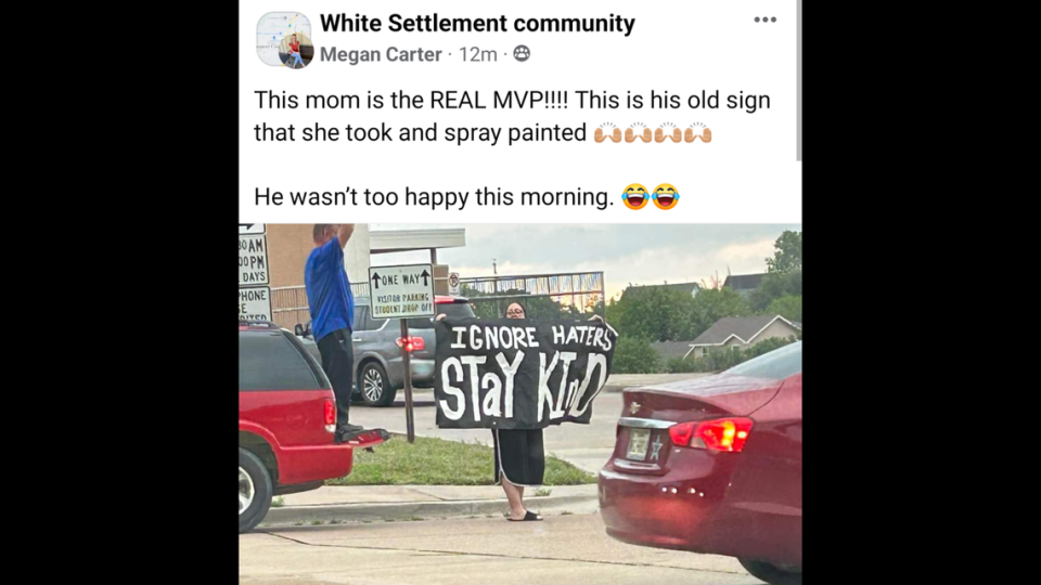 Casey Harmon repainted one of Evans’s signs and staged a counter-protest.