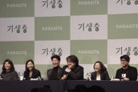 Bong Joon-ho, director of Oscar-winning “Parasite,” center right, speaks during a press conference in Seoul, South Korea, Wednesday, Feb. 19, 2020. Bong said Wednesday “the biggest pleasure and the most significant meaning” that the film has brought to him was its success in many countries though the audiences might feel uncomfortable with his explicit description of a bitter wealth disparity in modern society. (AP Photo/Ahn Young-joon)