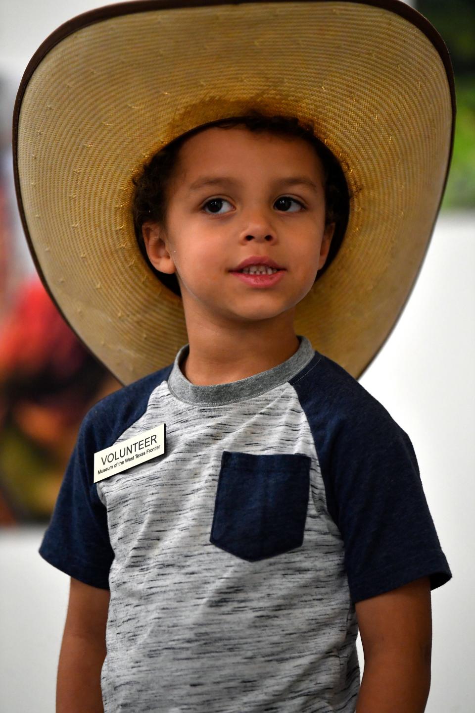 Roman Lee, 5, who helped out at the Museum of the West Texas Frontier is also the demographic for whom the institution's recent cotton program was created. Teaching children about the reach of agriculture is a central focus for the Stamford museum.