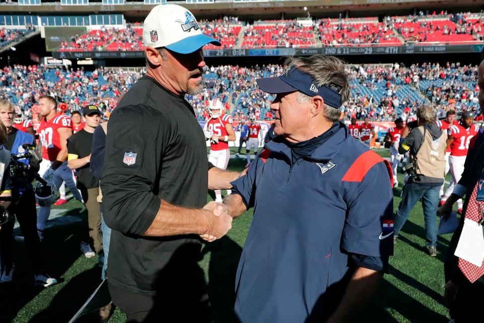 Lions head coach Dan Campbell, left, shakes hands with Patriots head coach Bill Belichick following a 29-0 New England win Sunday, Oct. 9, 2022, in Foxborough, Mass.