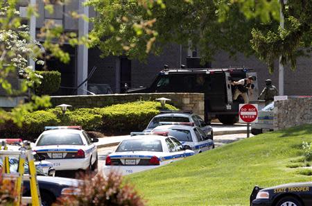 A SWAT team steps off their vehicle at ABC 2 news station in Towson, Maryland, May 13, 2014. REUTERS/Jose Luis Magana