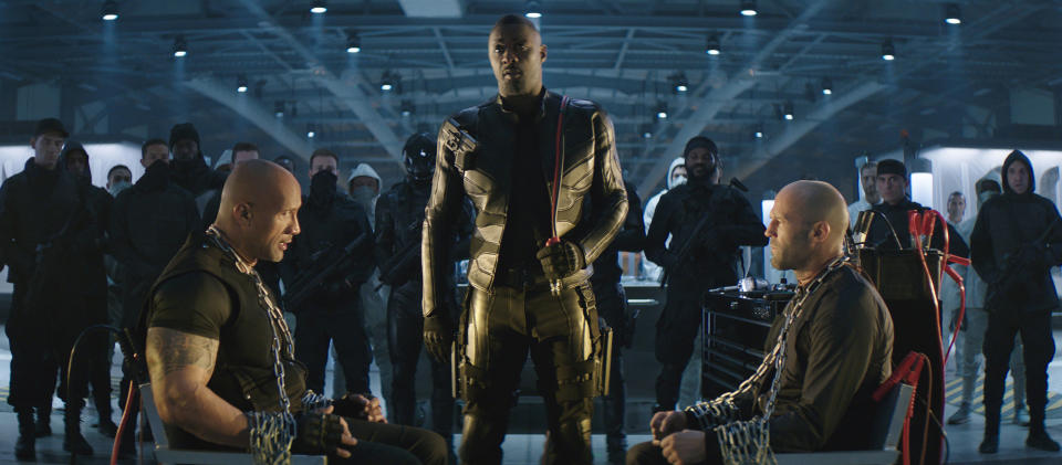 This image released by Universal Pictures shows, foreground from left, Dwayne Johnson, Idris Elba and Jason Statham in a scene from "Fast & Furious Presents: Hobbs & Shaw." (Universal Pictures via AP)