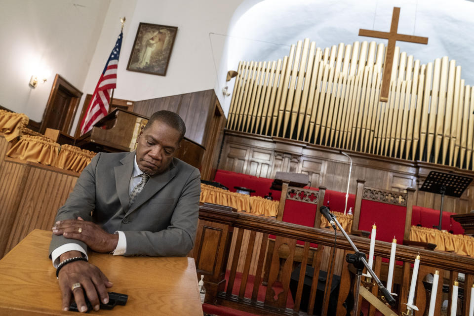 Rev. Jimmie Hardaway Jr. shows the gun he carries on him during services at Trinity Baptist Church Sunday, Aug. 20, 2023, in Niagara Falls, N.Y. “The world has changed. There’s things that we would not expect to take place in a house of worship that are taking place now,” he says. “And I would do what I have to do to protect myself and my loved ones, those around me.” (AP Photo/David Goldman)