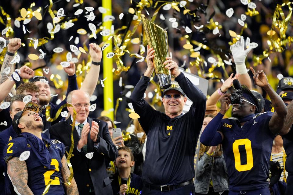 Michigan coach Jim Harbaugh celebrates after beating Washington to win the national championship on Jan. 8.